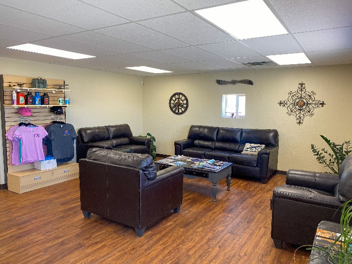 AIrport lobby, showing couches and table.